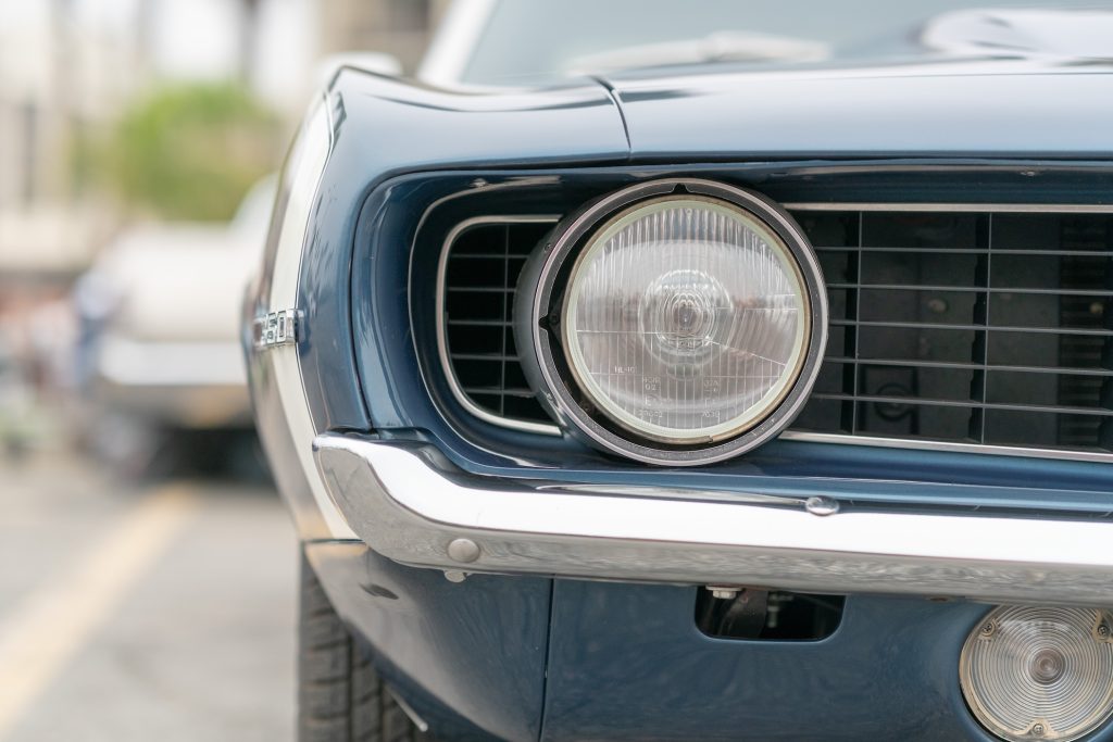 Close up of vintage blue car bumber and lamps