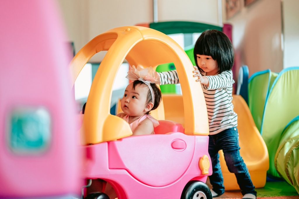 Happy two kids were having fun playing with toys together.Family with children at home. Love, trust and tenderness.Happy family lifestyle concept.