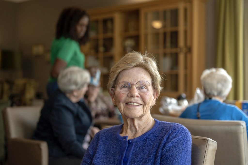 Helper caring for elderly lady
