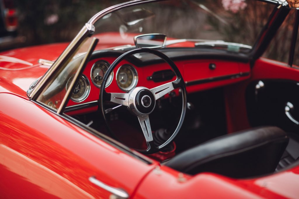 Red Alfa Romeo, Retro car rally. French riviera. Nice - Cannes - Saint-Tropez.