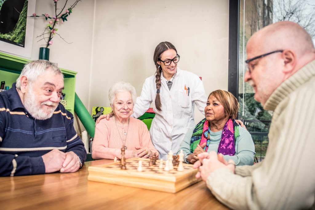 Senior adults in a nursing home for the elderly doing leisure activities